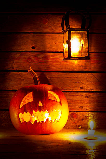 istock Halloween pumpkin with lantern and candle 520137311