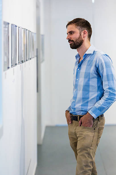 istock Hipster Man Visiting an Art Gallery 520137418