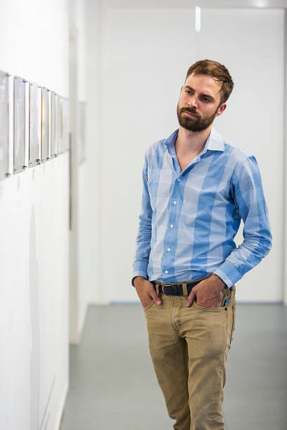 istock Hipster Man Visiting an Art Gallery 520137602