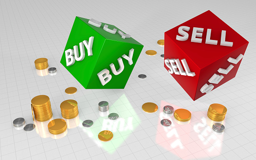 Green and red buy and sell cubes with stacks of gold and silver coins