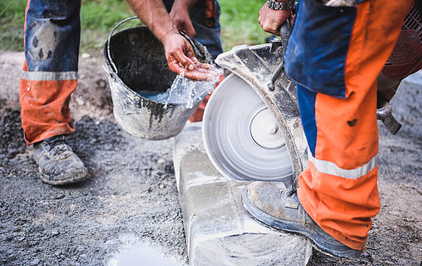 istock Construction worker cutting concrete paving stabs or metal for s 520137950