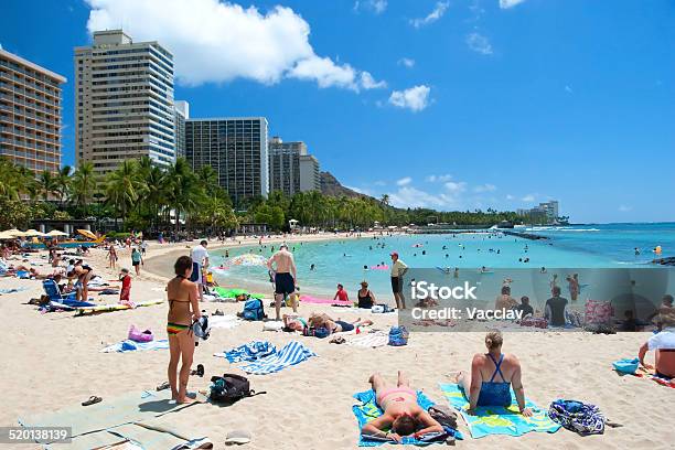 Tourist Sunbathing And Surfing On Waikiki Beach Hawaii Oahu Stock Photo - Download Image Now