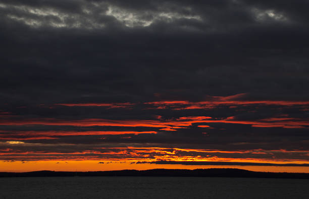 istock Fiery golden sunrise on a stormy morning 520138390