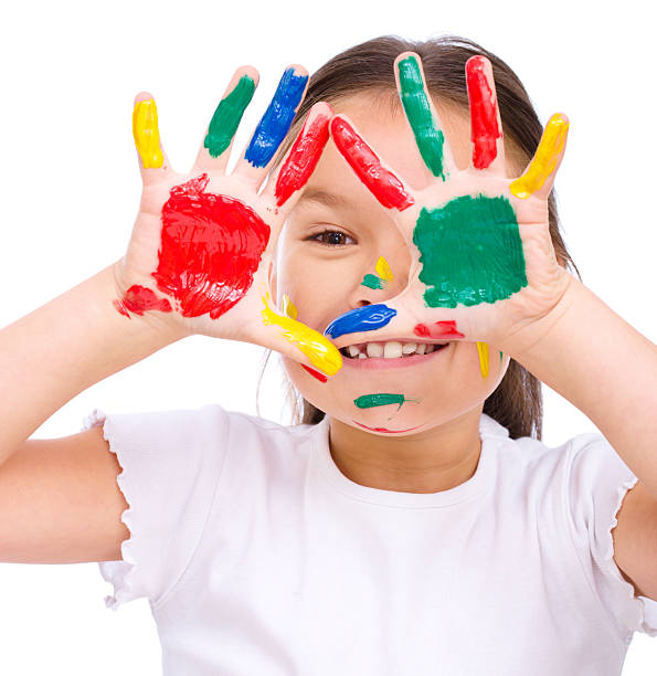 istock Cute girl playing with paints 520163543