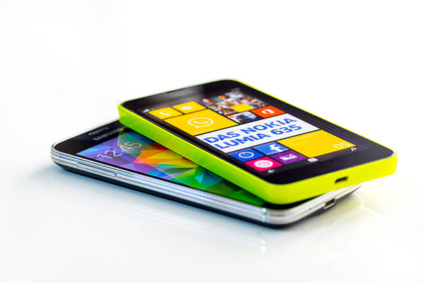 Hamburg, Germany - October 21, 2014: Studio shot of a Nokia Lumia 635 and Samsung Galaxy S5 mini Smartphone, isolated on a white background.