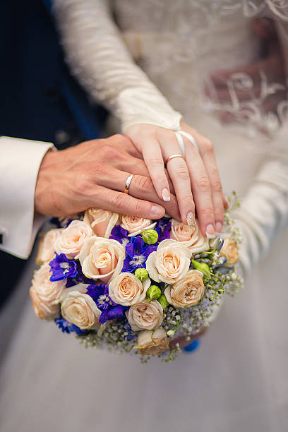 istock Beautiful wedding bouquet in hands of the bride 520166406
