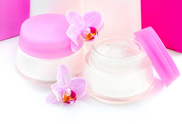 istock Face creams and beautiful orchid flowers on white background 520167776