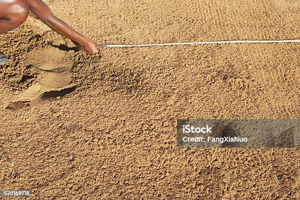 Measuring The Field Stock Photo - Download Image Now - Long Jump, Sand, In A Row
