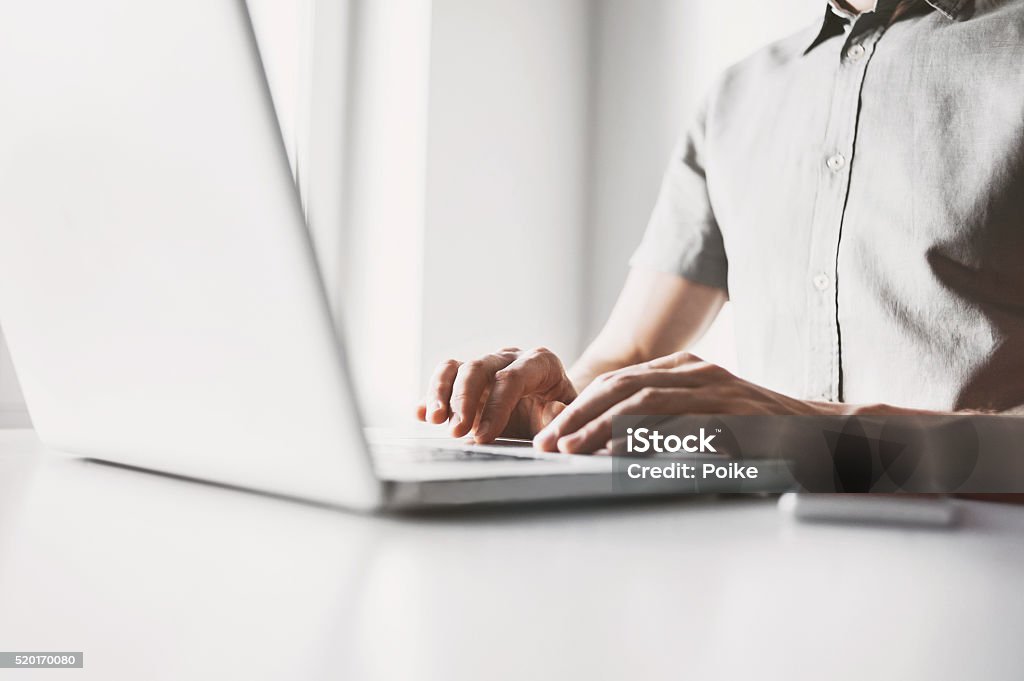 Using laptop Male hands on laptop keyboard Student Stock Photo