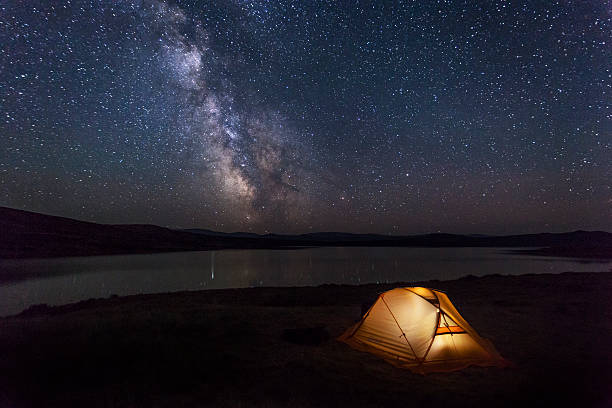 istock Tent with travelers in the mountains 520170198