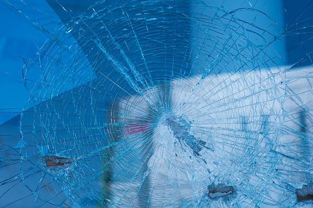 istock background broken glass from the bullets on facade building 520171042