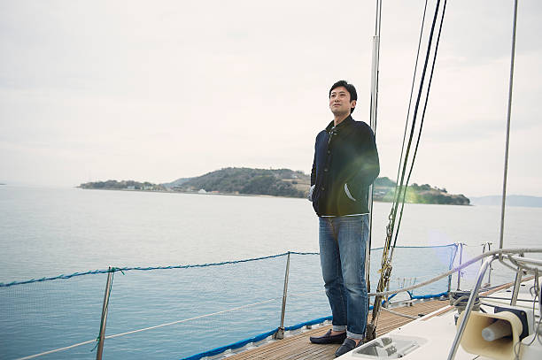 istock Mature man standing on a yacht 520172330