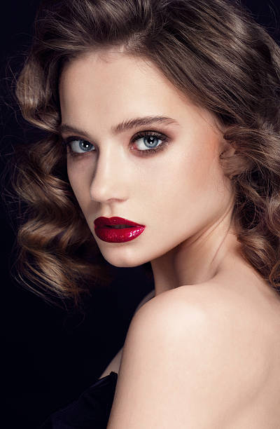 istock Beautiful woman face close up studio with red lips and 520172442