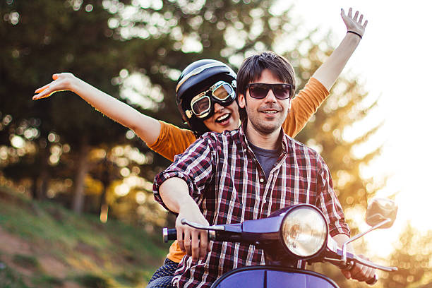 istock Happy couple on a scooter at summer vacation 520172762