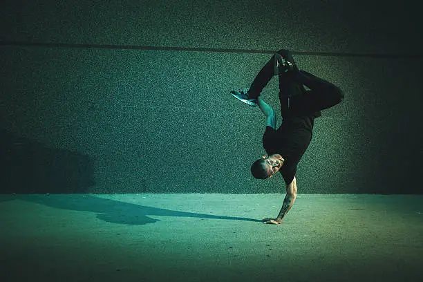 BBoy doing handstand on street