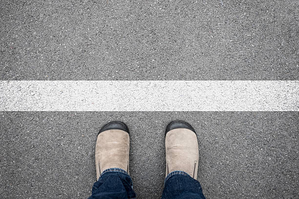 istock Brown shoes standing at the white line 520175862