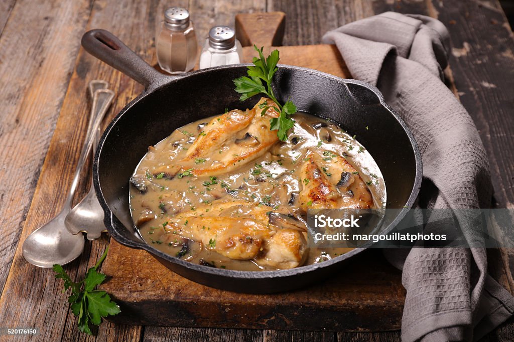 chicken cooked with cream and mushroom Edible Mushroom Stock Photo