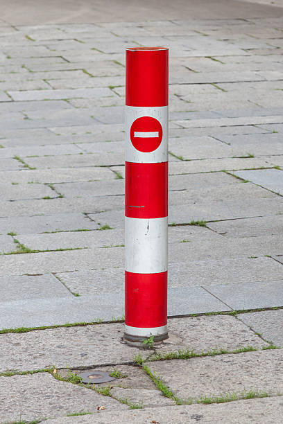 istock Red traffic pole and no entry sign with brick walk. 520177460