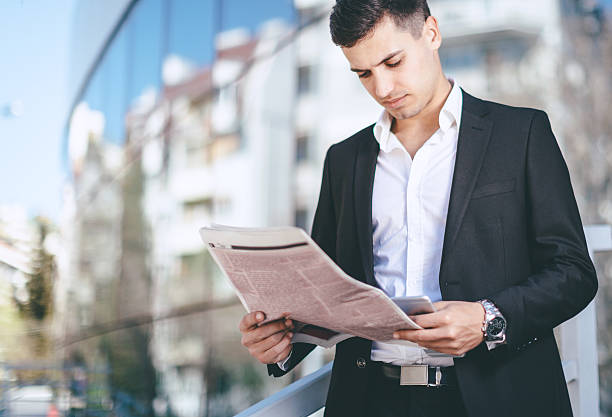 istock Businessman reading the news 520178682