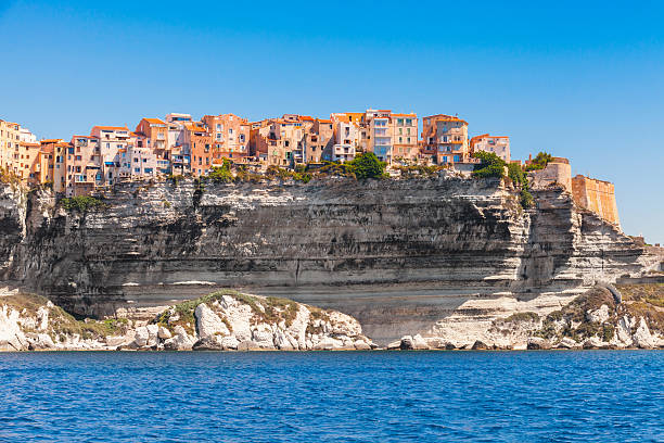 Colorful living houses on rocky coast, Bonifacio Colorful living houses on rocky coast of Bonifacio, mountainous Mediterranean island Corsica, Corse-du-Sud, France corsica photos stock pictures, royalty-free photos & images