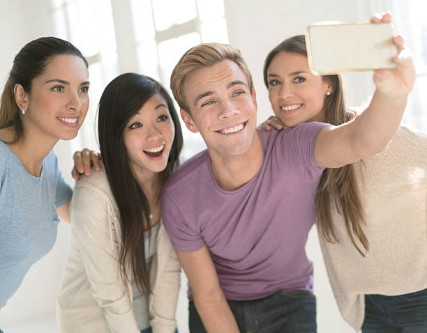 istock Group of friends taking a selfie at home 520180088