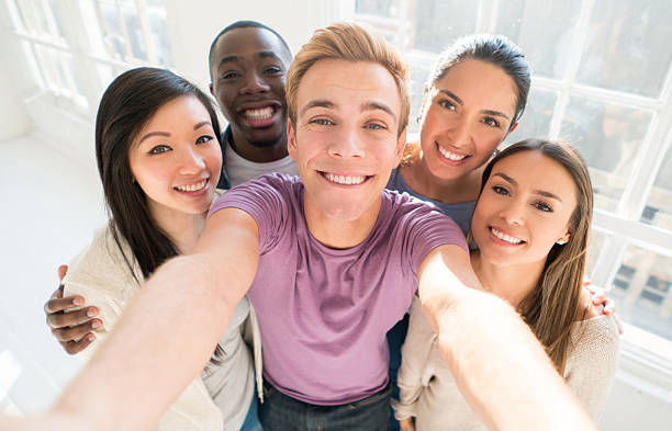 istock Group of friends taking a selfie indoors 520180190