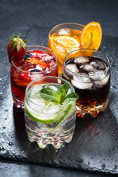 istock assortment of iced fruit drinks on a dark background, vertical 520180280