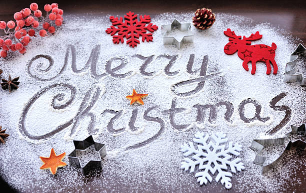 istock Merry Christmas text made with flour with decorations on cutting 520180336