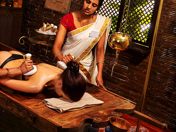 istock Indian woman doing massage with a bag of rice 520181766