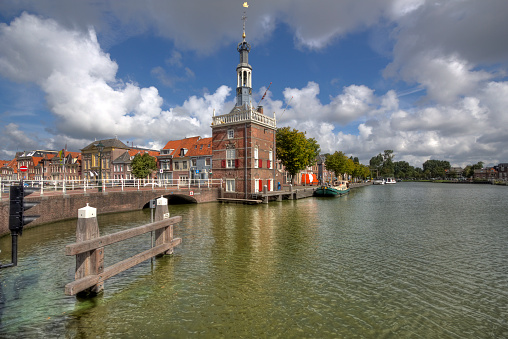 Amsterdam, Netherlands – March 21, 2023: Traditional houses of the 17th century in the downtown of Amsterdam.