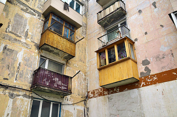Angle old dirty apartment with balconies,