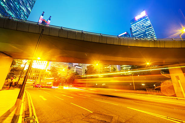 istock traffic light trails of modern business city 520194043
