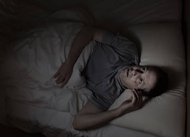 istock Mature man not able to fall asleep during night time 520195699