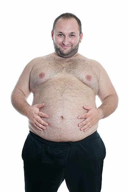 Overweight or Fat Shirtless Man Showing his Belly Overweight or Fat  Shirtless Man Showing his Belly. Isolated on White. fat guy no shirt stock pictures, royalty-free photos & images