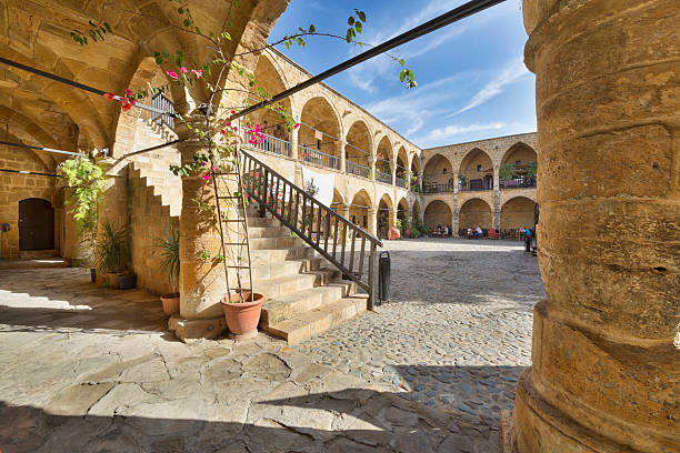 Great Inn (Buyuk Han) in Nicosia (Lefkosa), Cyprus The Great Inn (Turkish: Buyuk Han) is the largest caravanserai on the island of Cyprus. It's located in Lefkosa (Nicosia), Turkish Republic of Northern Cyprus. it was built by the Ottomans in 1572. nicosia cyprus stock pictures, royalty-free photos & images
