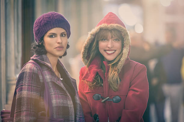 istock Young women looking for christmas present around old town centre 520197751