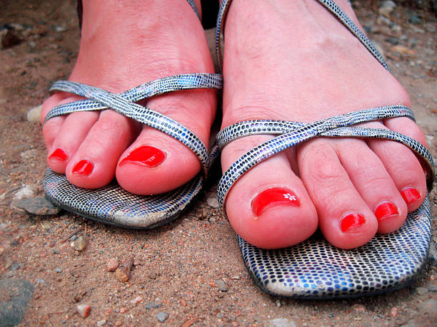 istock Woman feet standing standing on the ground 520214733