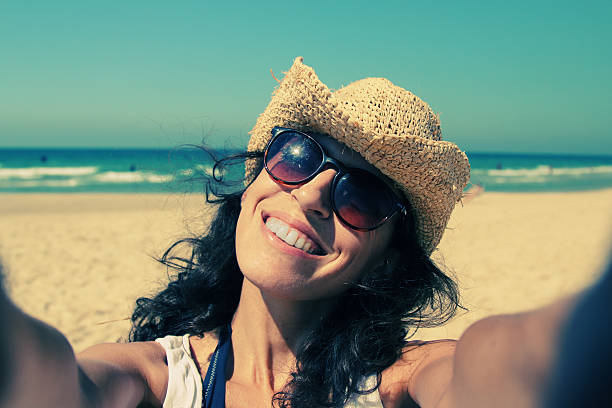 istock Beautiful girl smiling on the beach 520216925