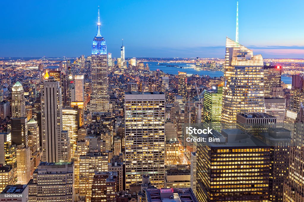 New York Illuminated at Dusk, Elevated View skyscrapers in Manhattan illuminated at twilight, elevated view Aerial View Stock Photo