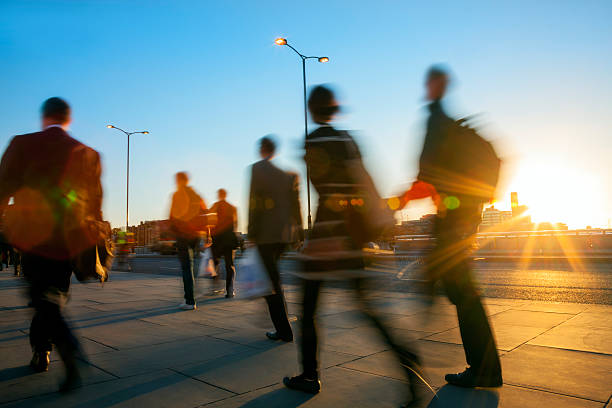 istock Silhouettes of Blurred Business Commuters in Sunset Light 520218441