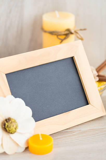 istock Spa candles and blank wooden frame 520218603