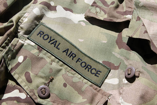 RAF military uniform Close-up of the Royal Air Force military camouflage uniform symbolizing war, peace and military intervention raf stock pictures, royalty-free photos & images