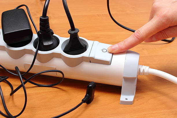 istock Electrical cords connected to power strip, concept of energy saving 520219223