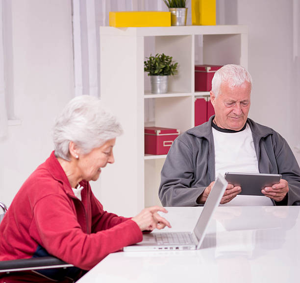 istock Senior couple looking something on touchpad 520220407