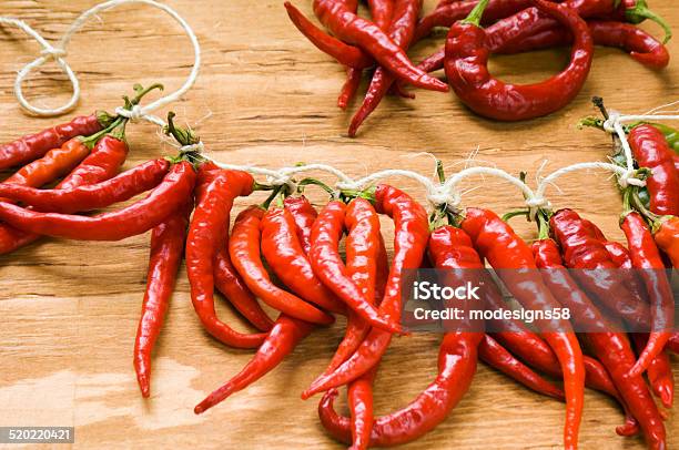 String Of Red Chiles For Drying And Storing Stock Photo - Download Image Now - Chili Pepper, Color Image, Drying