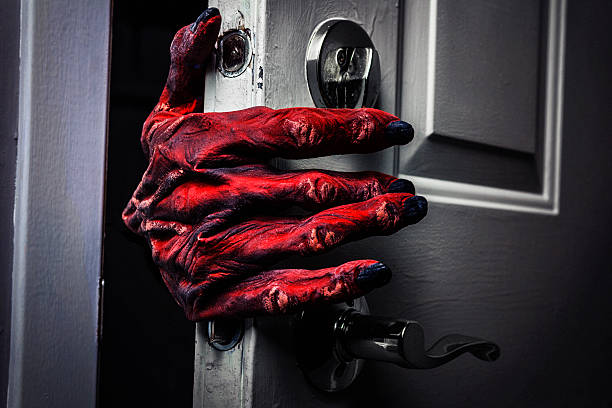 Monster's Hand Comming in the Door Creepy monster hand emerging from the front door. monster fictional character stock pictures, royalty-free photos & images