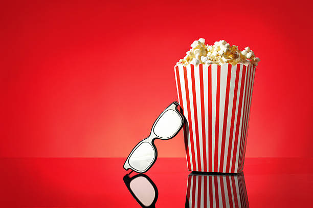 istock Movie Popcorn with 3D glasses Sitting on a Red Background 520220561