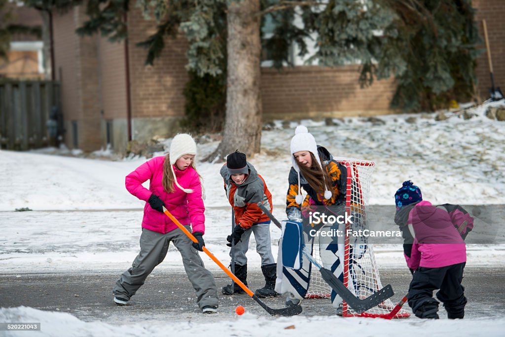 Road hockey Kids playing hockey on the road Street Hockey Stock Photo