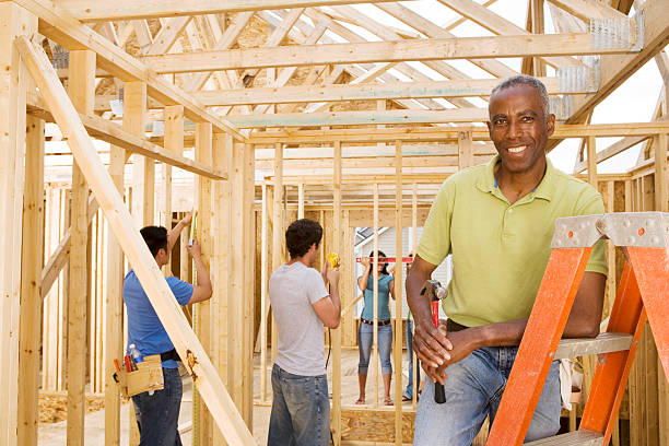 istock Male volunteer at home construction site, portrait 520221161