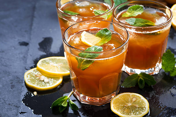 istock refreshing iced tea with mint and lemon on dark background 520221188